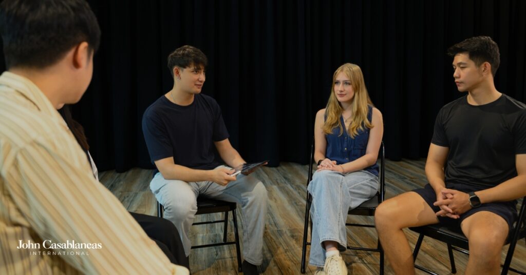 a group of actors in training